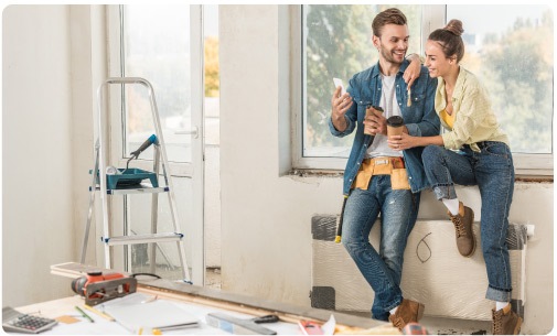 Two people working on DIY project in home