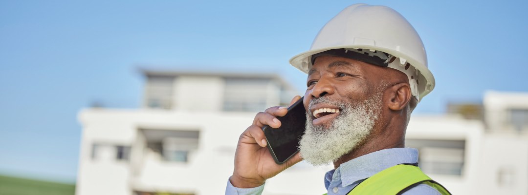 Construction contractor on the phone