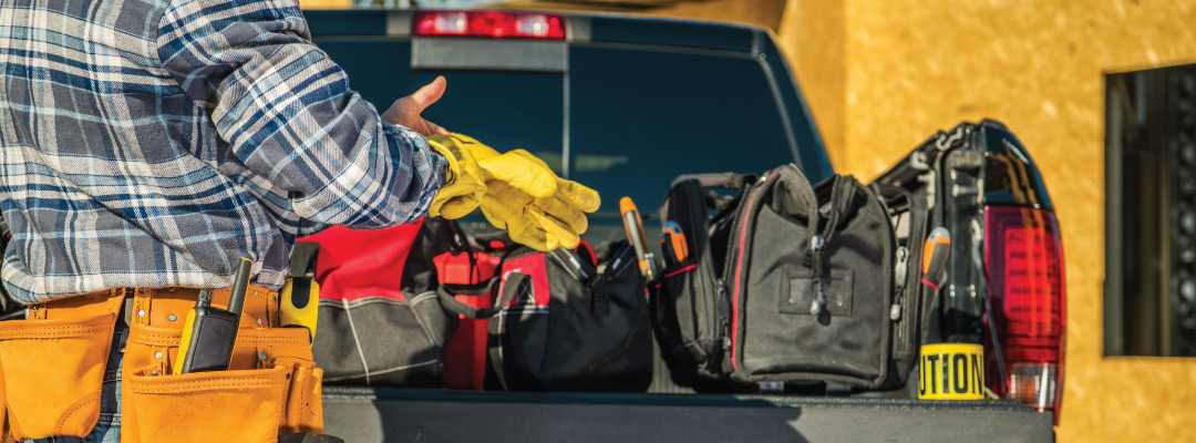 Contractor and tools in the back of a truck