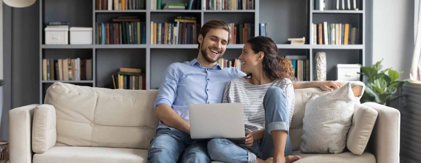 Happy couple sitting on couch