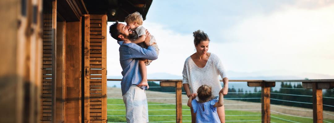 Family on vacation at log cabin